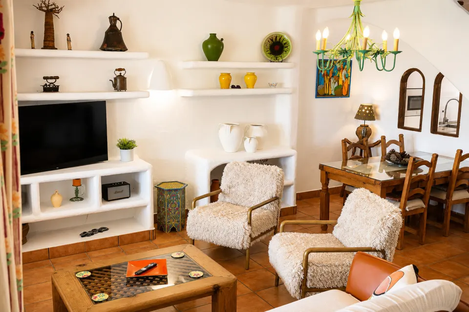 Living room with TV and armchairs